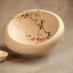 Sakura nest platter interior with hand-painted blossom and bird motif