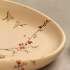 Sakura oval platter interior with hand-painted cherry blossom branch