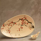 Sakura leaf-shaped serving platter with hand-painted blossom branch