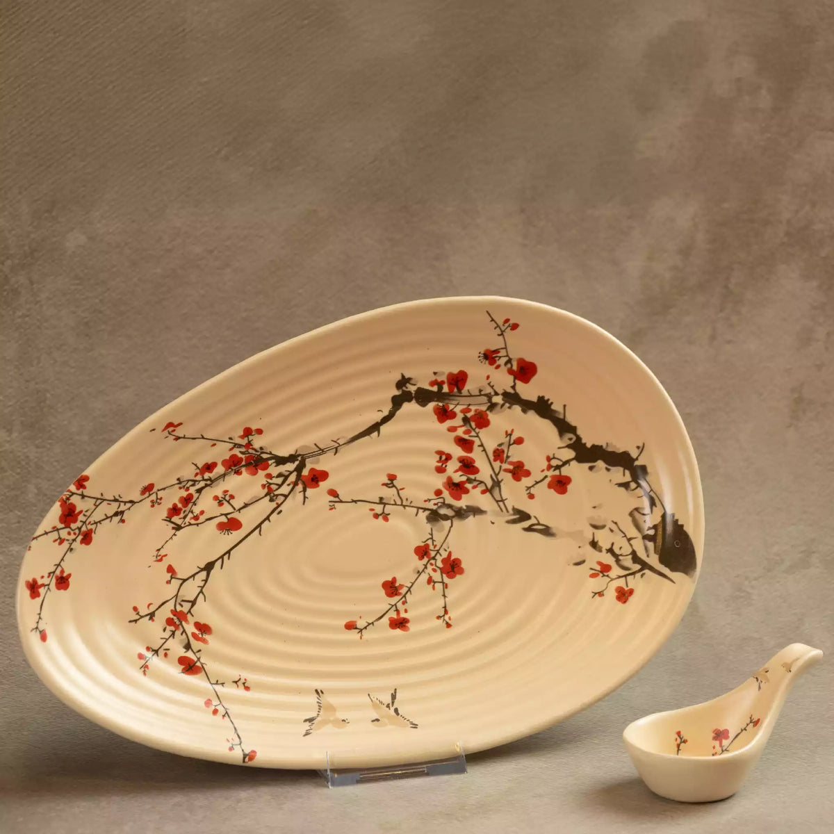 Sakura leaf-shaped serving platter with hand-painted blossom branch