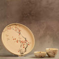 Sakura dinner plate upright with small bowl, red blossom branch