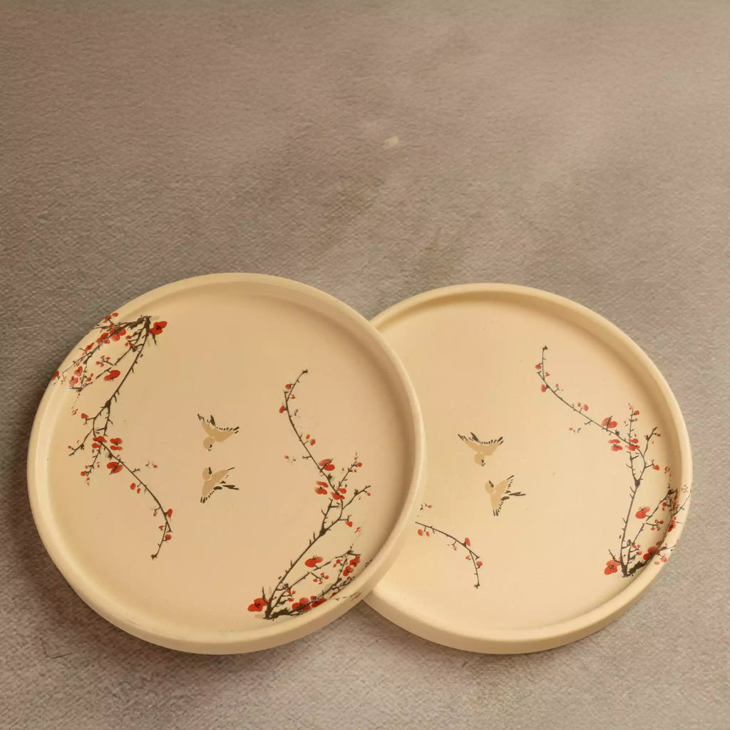 Sakura side plates pair, beige ceramic with red blossom detail
