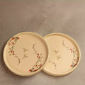 Sakura side plates pair, beige ceramic with red blossom detail