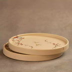 Stacked Sakura side plates showing rimmed edge and blossom motif