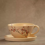 Wide Sakura tea cup on saucer with hand-painted cherry blossom design