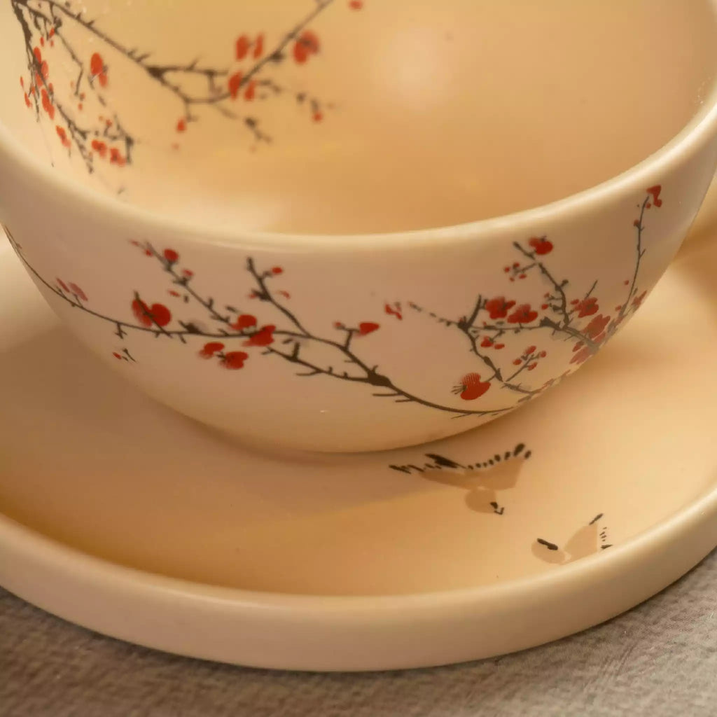 Close-up of Sakura tea cup rim with cherry blossom branch painting