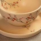 Close-up of Sakura tea cup rim with cherry blossom branch painting