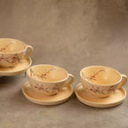 Three Sakura tea cups on saucers with hand-painted cherry blossoms