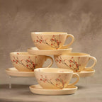 Sakura tea cup and saucer set stacked, beige cherry blossom ceramics