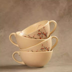 Two stacked Sakura ceramic tea cups with cherry blossom pattern