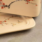 Close-up of Sakura butter dish lid and tray with cherry blossom painting