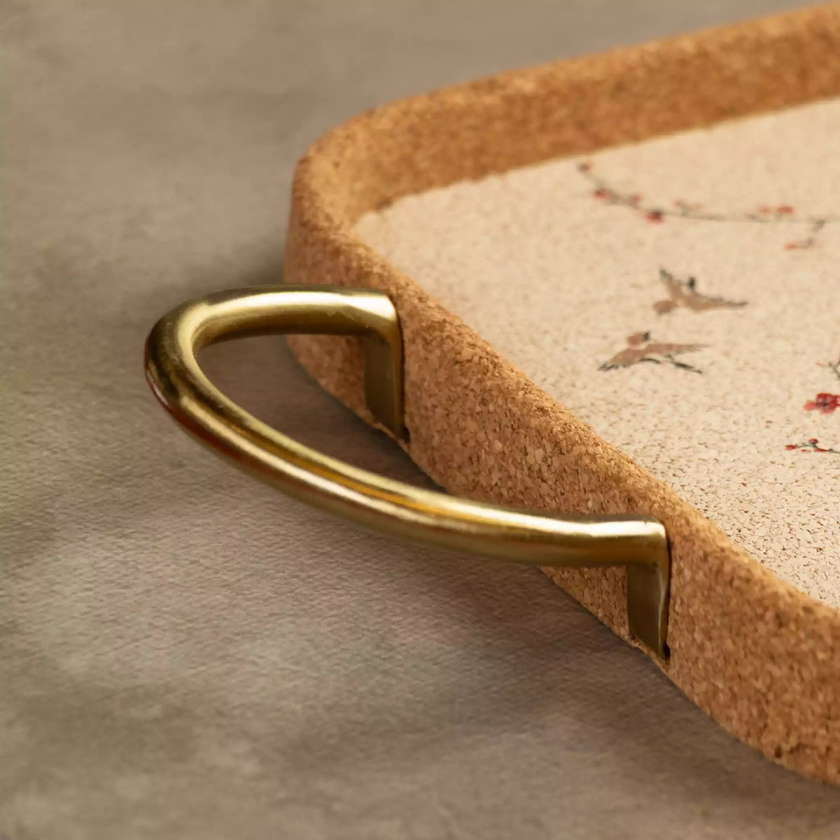 Sakura serving tray brass handle detail with bird motif