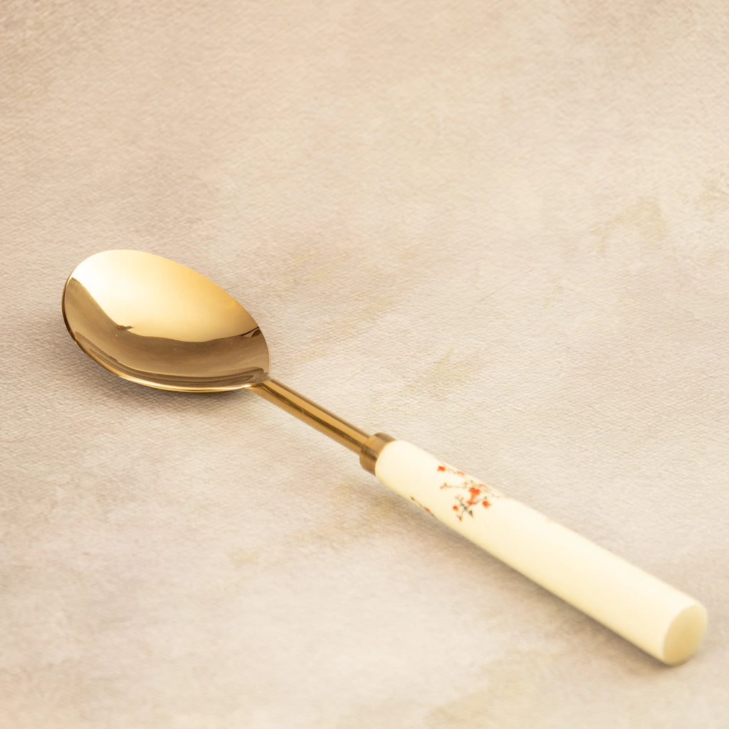 Sakura serving spoon angled view with painted blossom handle
