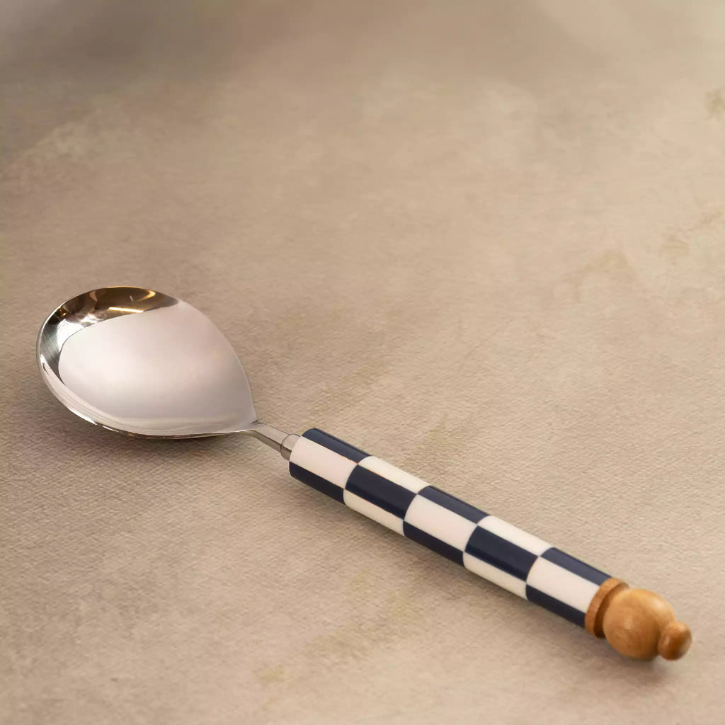 Blue checkers serving spoon upright with wooden end knob