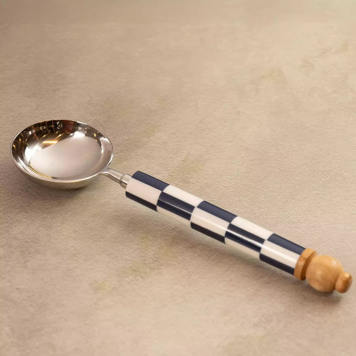 Blue checkers ladle with navy and white checkerboard handle