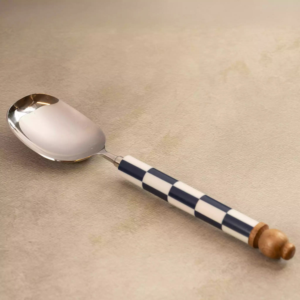 Blue checkers serving spoon with wooden knob handle
