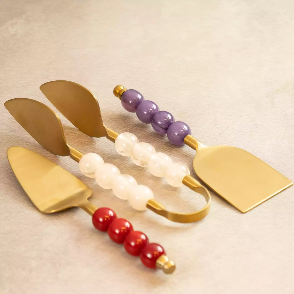 Bubbles tongs and spatulas trio with white, purple and red bead handles