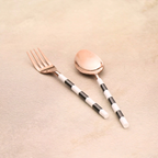 Rose gold fork and spoon pair with striped handles