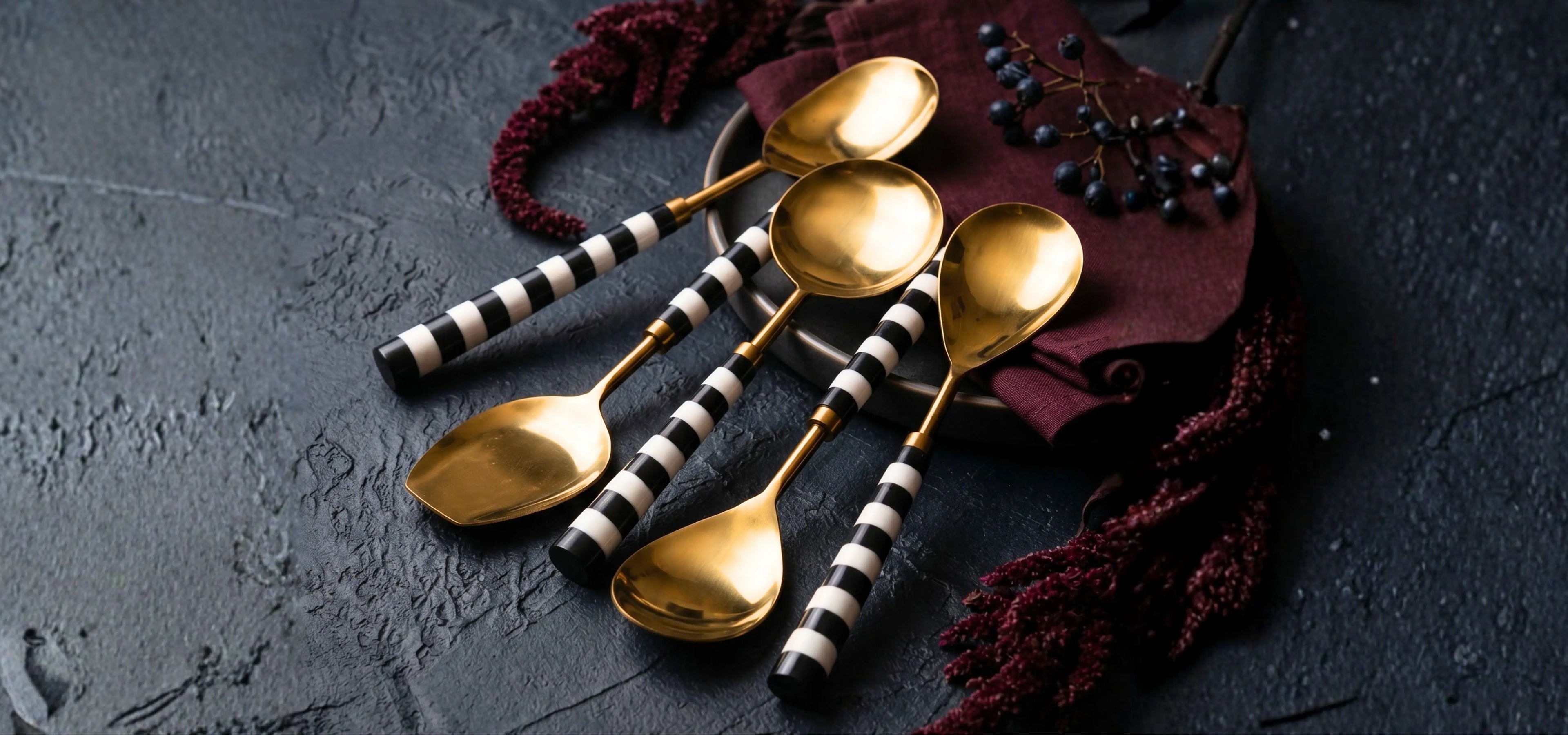 Handcrafted gold serveware on dark table setting – The Sanctum Designs