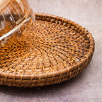 Rattan tray base close-up of glass dome server
